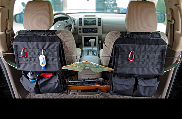 Flex OPS holding recurve bow and rifle